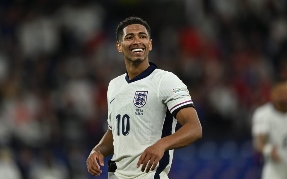 Jude Bellingham smiling while playing for England vs Serbia