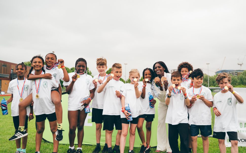 Children compete in community sports day alongside GB sprinter