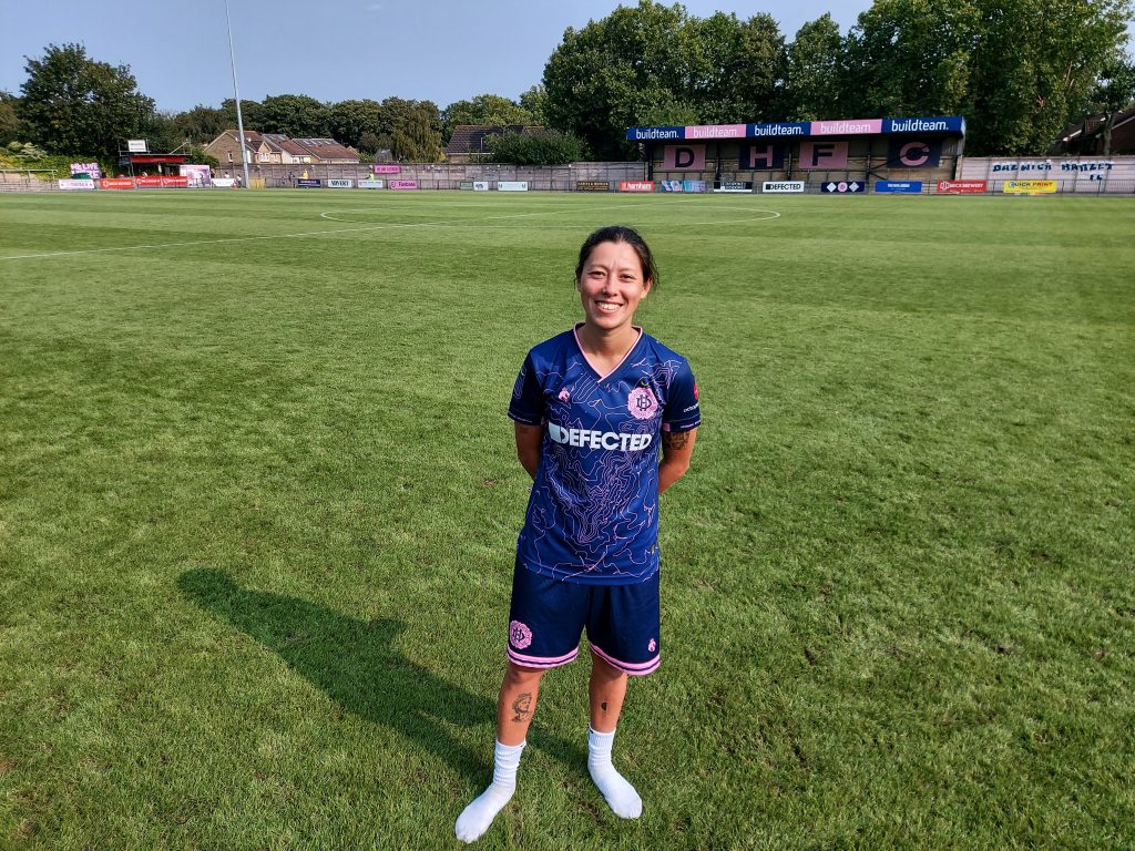 Dulwich Hamlet Women player Lucy Monkman standing on Champion Hill pitch