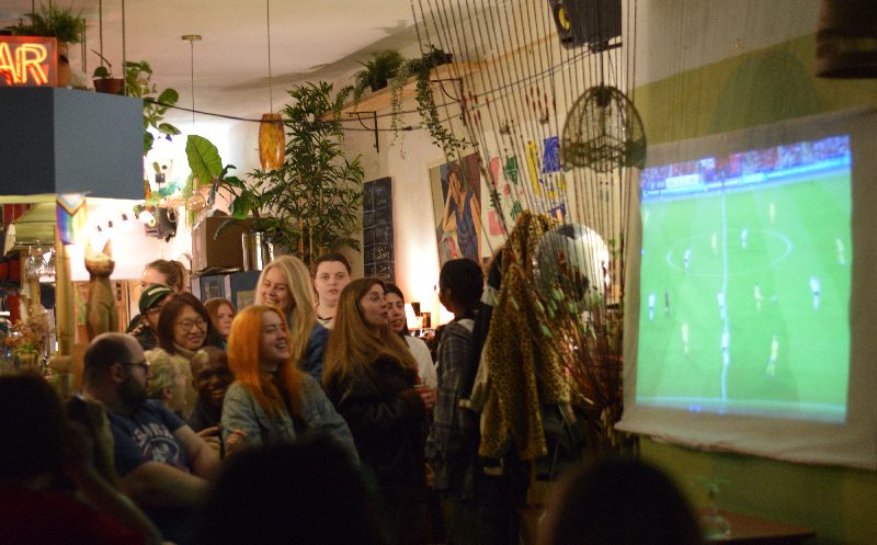 Women watching football in bar