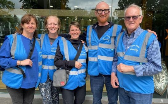 A group of community patrollers in high visibility jackets