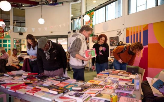 People browsing the Book Swap at Deptford Literature Festival 2024.